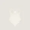 Body con aberturas en punto y perlas bordadas Body con aberturas en punto y perlas bordadas