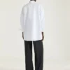 Camisa asimétrica de popelín con lentejuelas Camisa asimétrica de popelín con lentejuelas