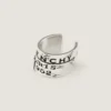 Earcuff Tape de Givenchy en metal y esmalte Earcuff Tape de Givenchy en metal y esmalte