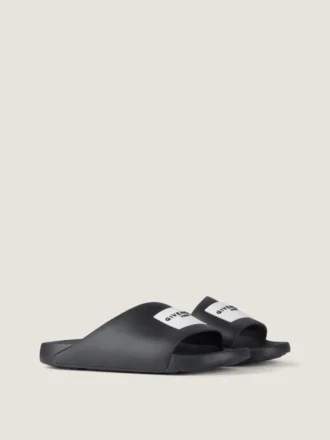 Mules con tiras de la línea Label en caucho